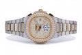 Custom diamond-set two-tone Nautilus with pavé bezel and bracelet